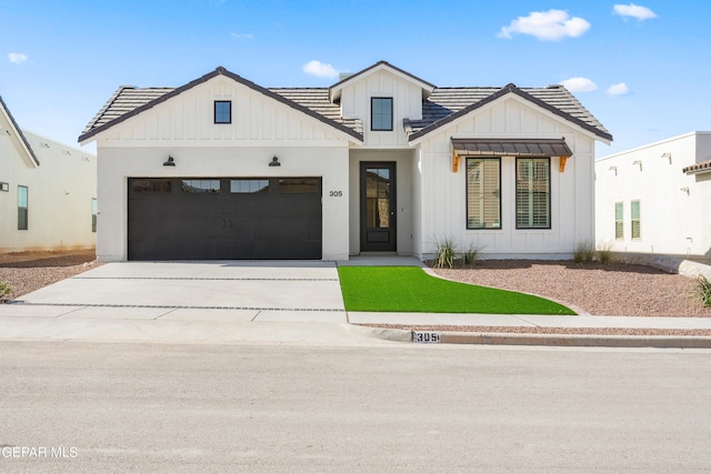 modern farmhouse featuring a garage