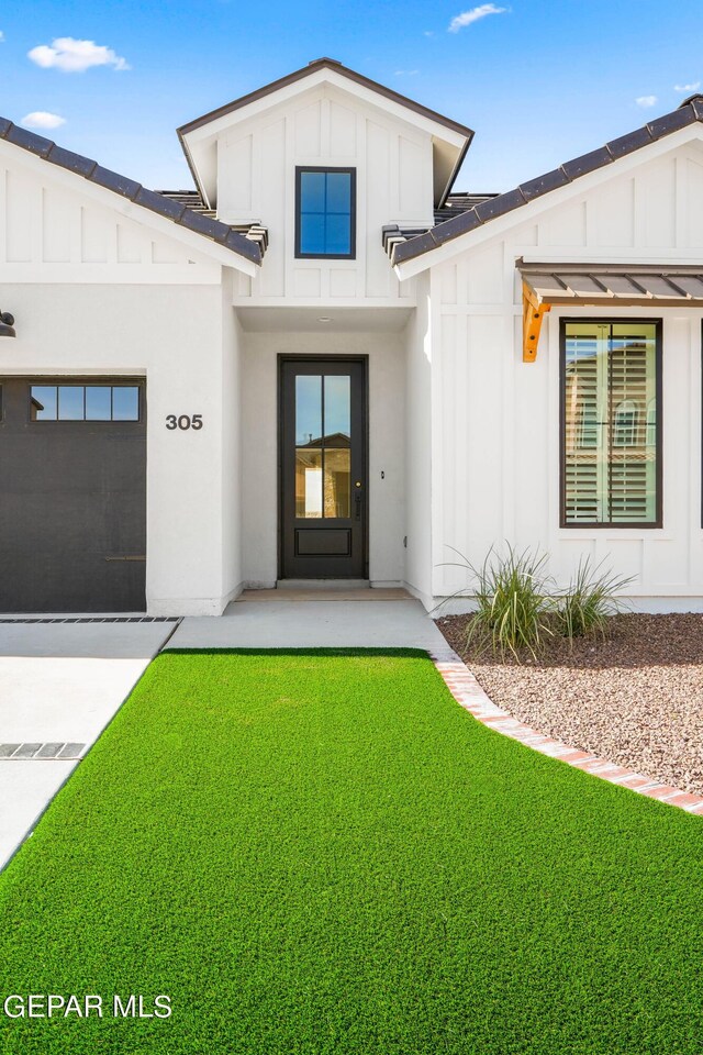 205 Playa Vista St, El Paso, TX 79928 - doorway to property with board and batten siding