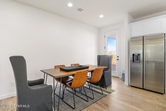 dining space featuring light hardwood / wood-style flooring