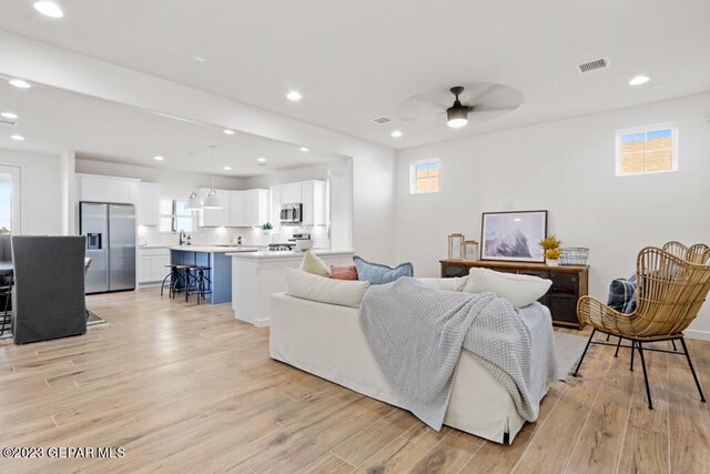 205 Playa Vista St, El Paso, TX 79928 - living area featuring plenty of natural light, light wood-type flooring, recessed lighting, and ceiling fan