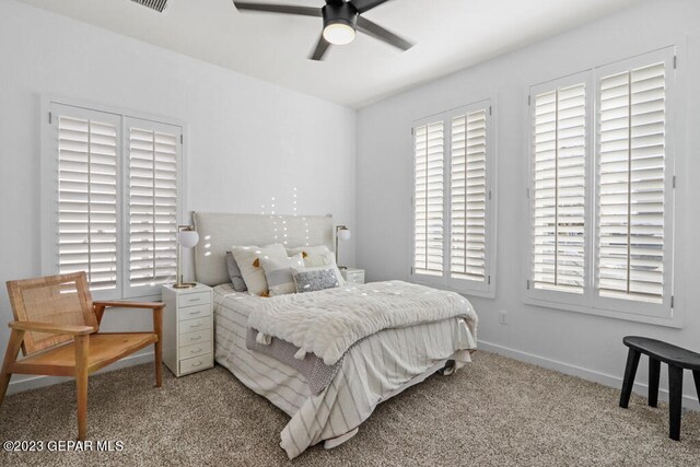 bedroom featuring ceiling fan and light colored carpet