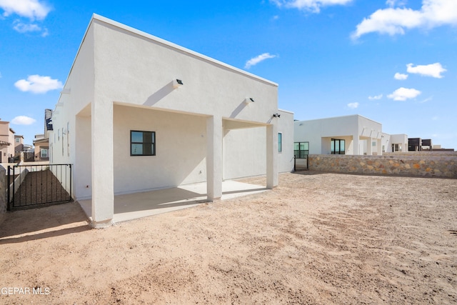 rear view of house featuring a patio area