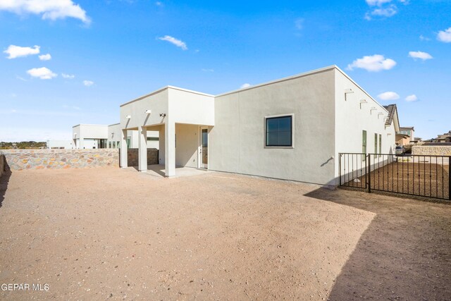 205 Playa Vista St, El Paso, TX 79928 - rear view of property with fence, stucco siding, and a patio area