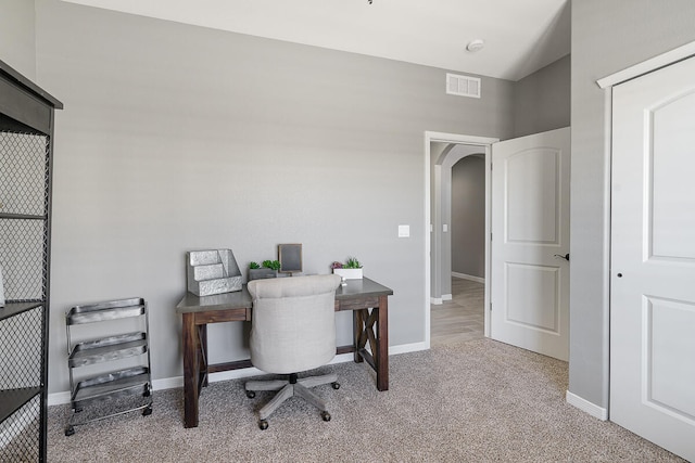 office space with light colored carpet