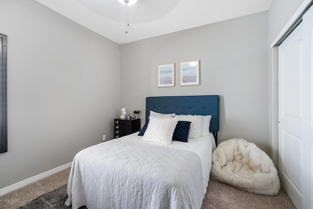 bedroom with carpet flooring, ceiling fan, and a closet