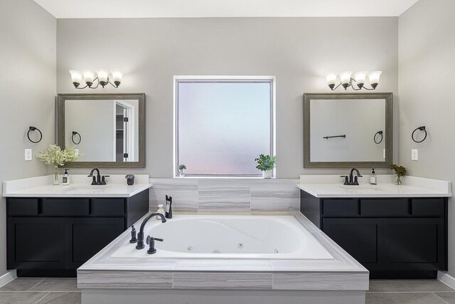 208 Playa Vista St, Horizon City, TX 79928 - full bath with two vanities, a jetted tub, and tile patterned floors