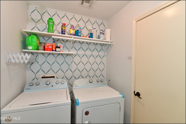 laundry room featuring washer and clothes dryer