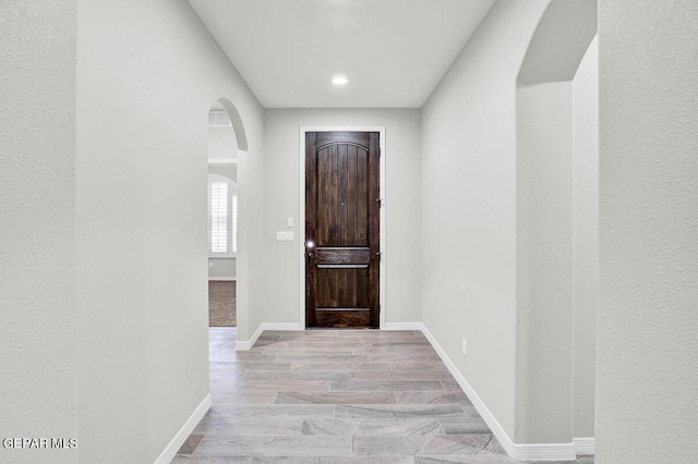 foyer entrance with light wood-type flooring