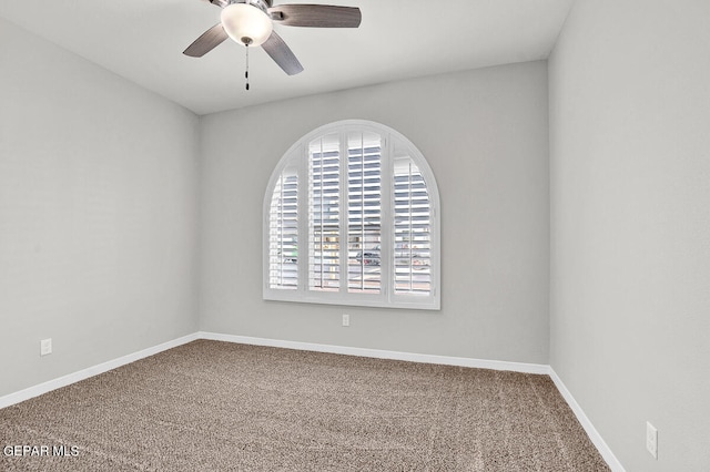 unfurnished room featuring carpet and ceiling fan