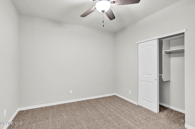 unfurnished bedroom with carpet flooring, a closet, and ceiling fan