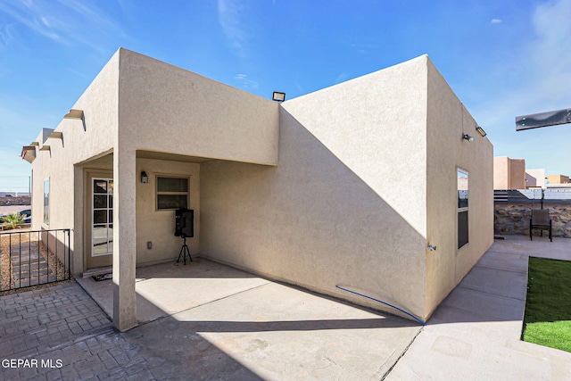 rear view of house featuring a patio area