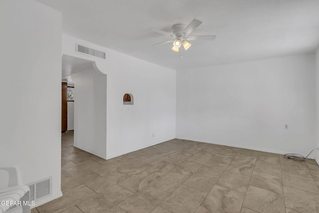 spare room with ceiling fan