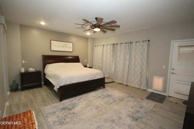 bedroom featuring light wood-type flooring and ceiling fan