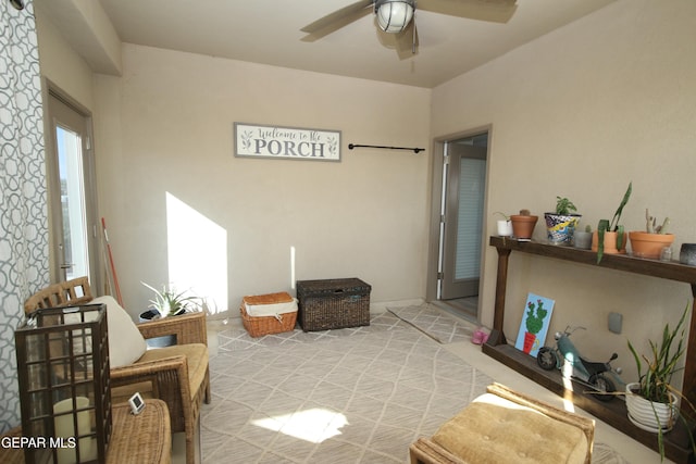 sitting room featuring ceiling fan and a healthy amount of sunlight