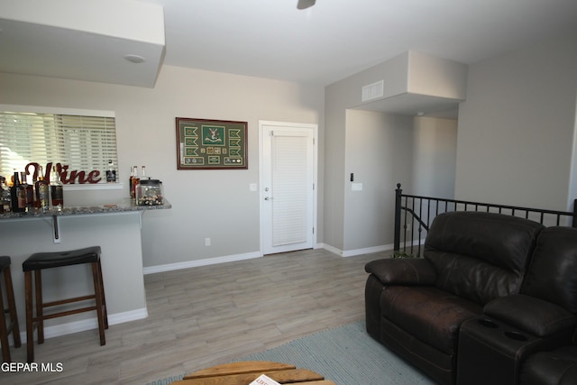 living room with light hardwood / wood-style flooring