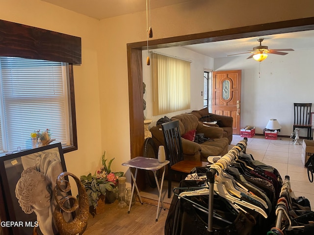 living room with ceiling fan and light hardwood / wood-style floors