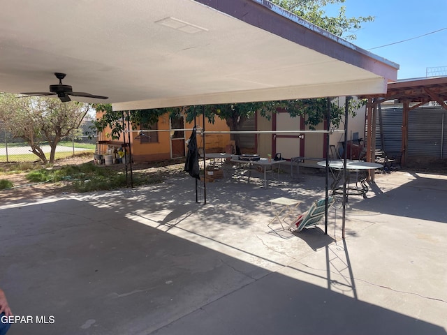 view of patio featuring ceiling fan