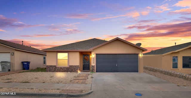 single story home featuring a garage