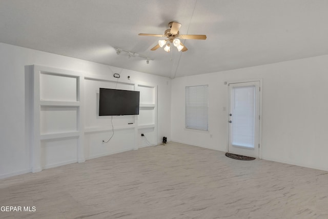 unfurnished living room featuring ceiling fan, lofted ceiling, and a textured ceiling