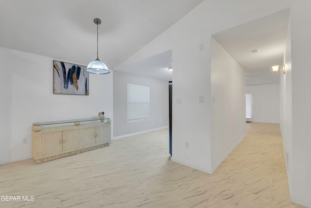 unfurnished dining area with vaulted ceiling