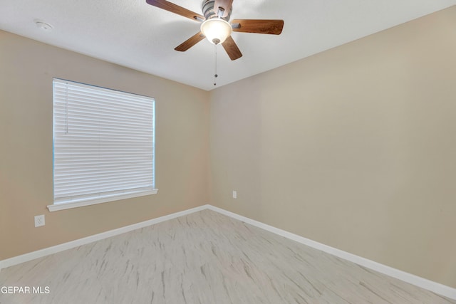 unfurnished room with ceiling fan