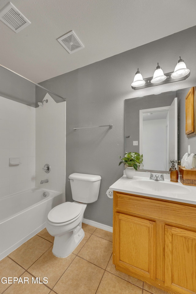 full bathroom with tile patterned flooring, vanity, toilet, and tiled shower / bath