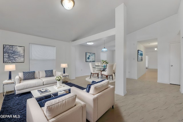 living room featuring vaulted ceiling