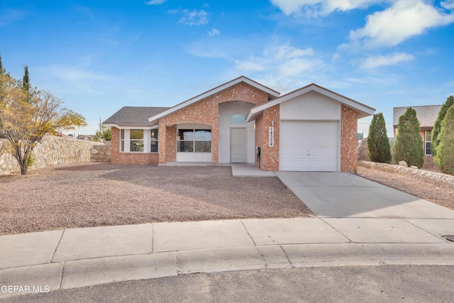 single story home featuring a garage