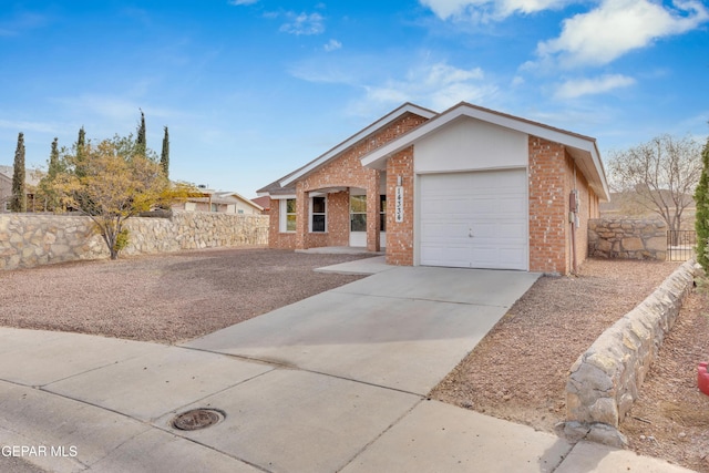 single story home featuring a garage