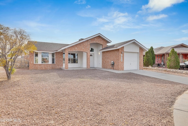 ranch-style home featuring a garage