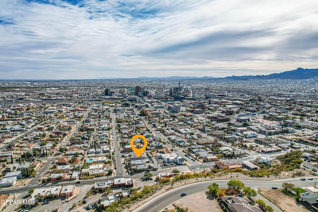 birds eye view of property featuring a mountain view