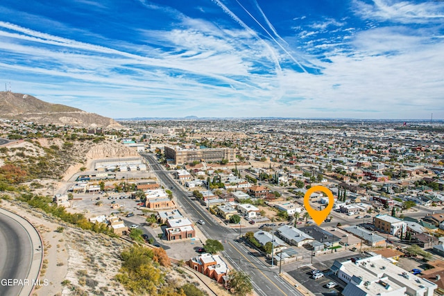 birds eye view of property with a mountain view