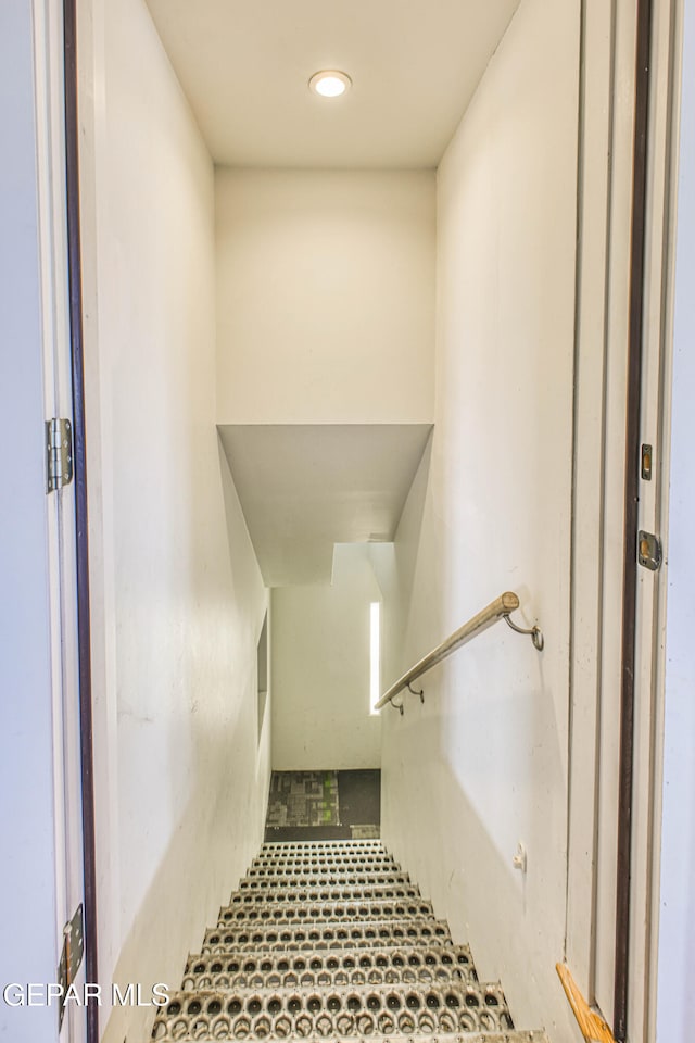 staircase with tile patterned floors