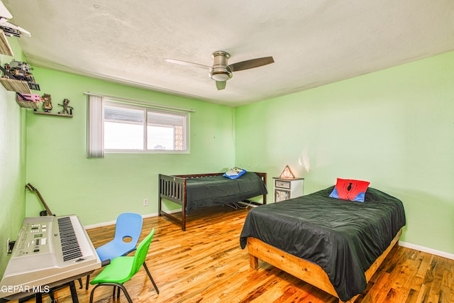 bedroom featuring ceiling fan and light wood-type flooring