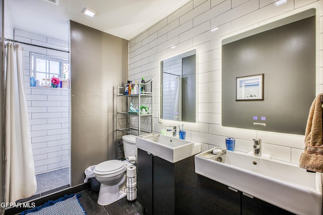 bathroom featuring a shower with curtain, sink, toilet, tile walls, and wood-type flooring