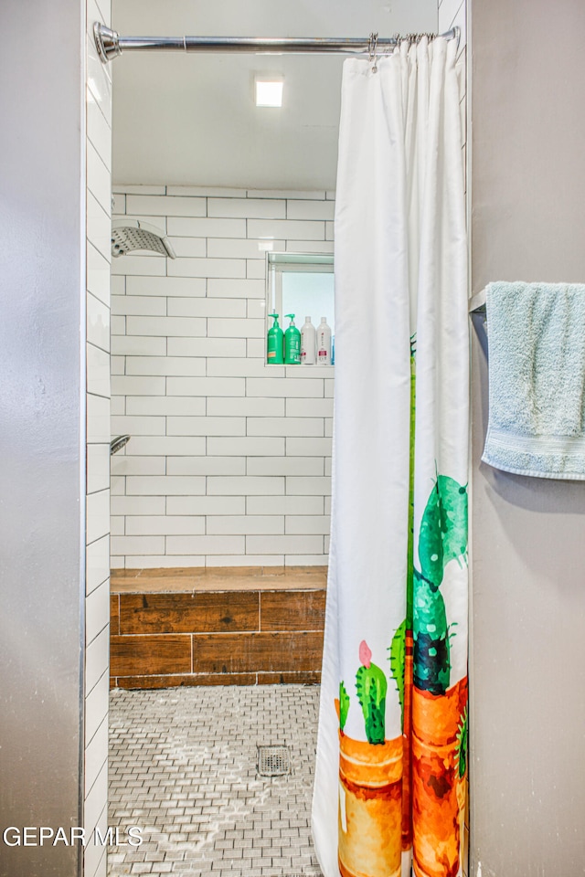 bathroom with curtained shower