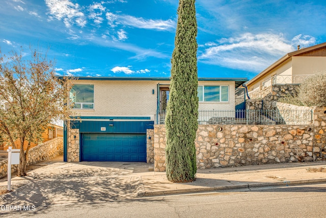 view of front of property with a garage