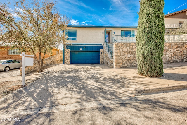 view of front of property featuring a garage