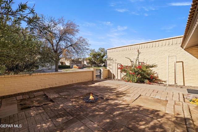 view of patio / terrace with an outdoor fire pit