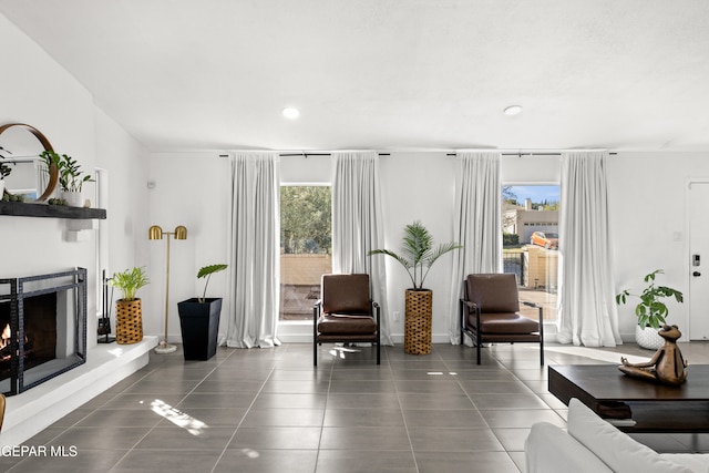 sitting room with dark tile patterned flooring