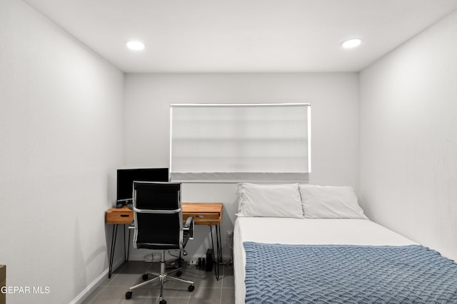 bedroom with light tile patterned floors