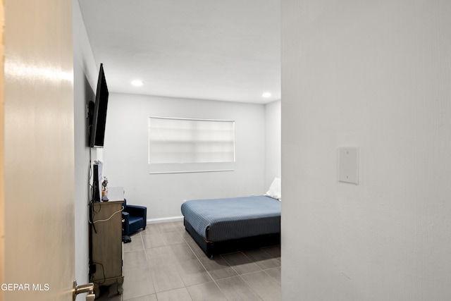 bedroom featuring light tile patterned floors