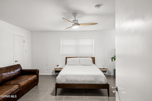 tiled bedroom with ceiling fan