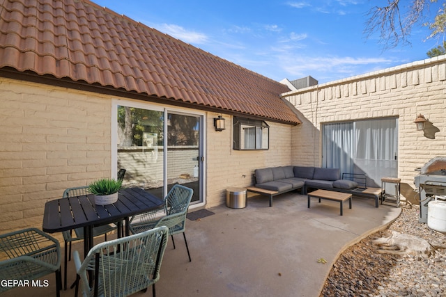 view of patio with grilling area and an outdoor hangout area