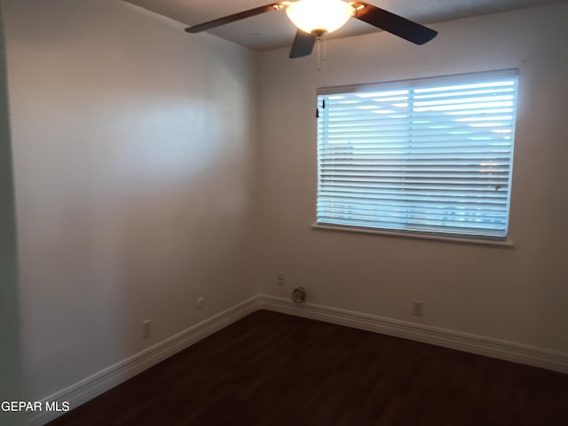 spare room featuring hardwood / wood-style flooring and ceiling fan