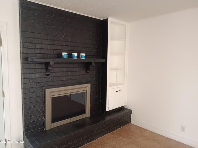 interior details featuring a fireplace and a textured ceiling