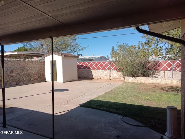 view of patio featuring a shed