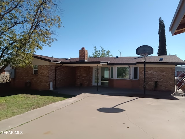 back of property featuring a patio