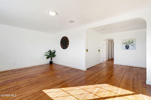 empty room with wood-type flooring