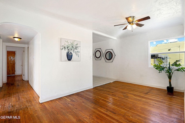 spare room with hardwood / wood-style flooring and ceiling fan